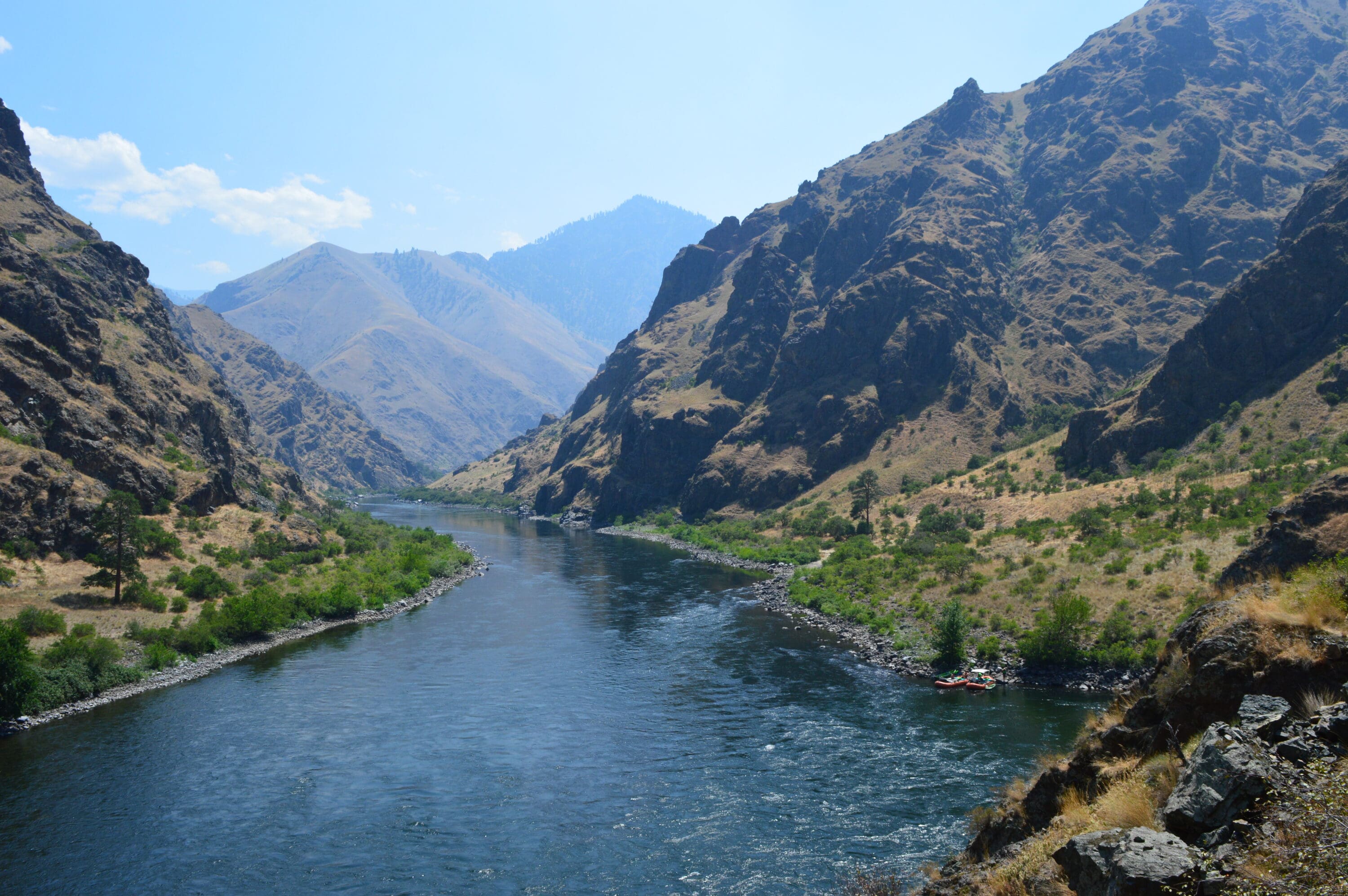 Large river gorge with deep canyon walls and beautiful river water snaking through the canyon.